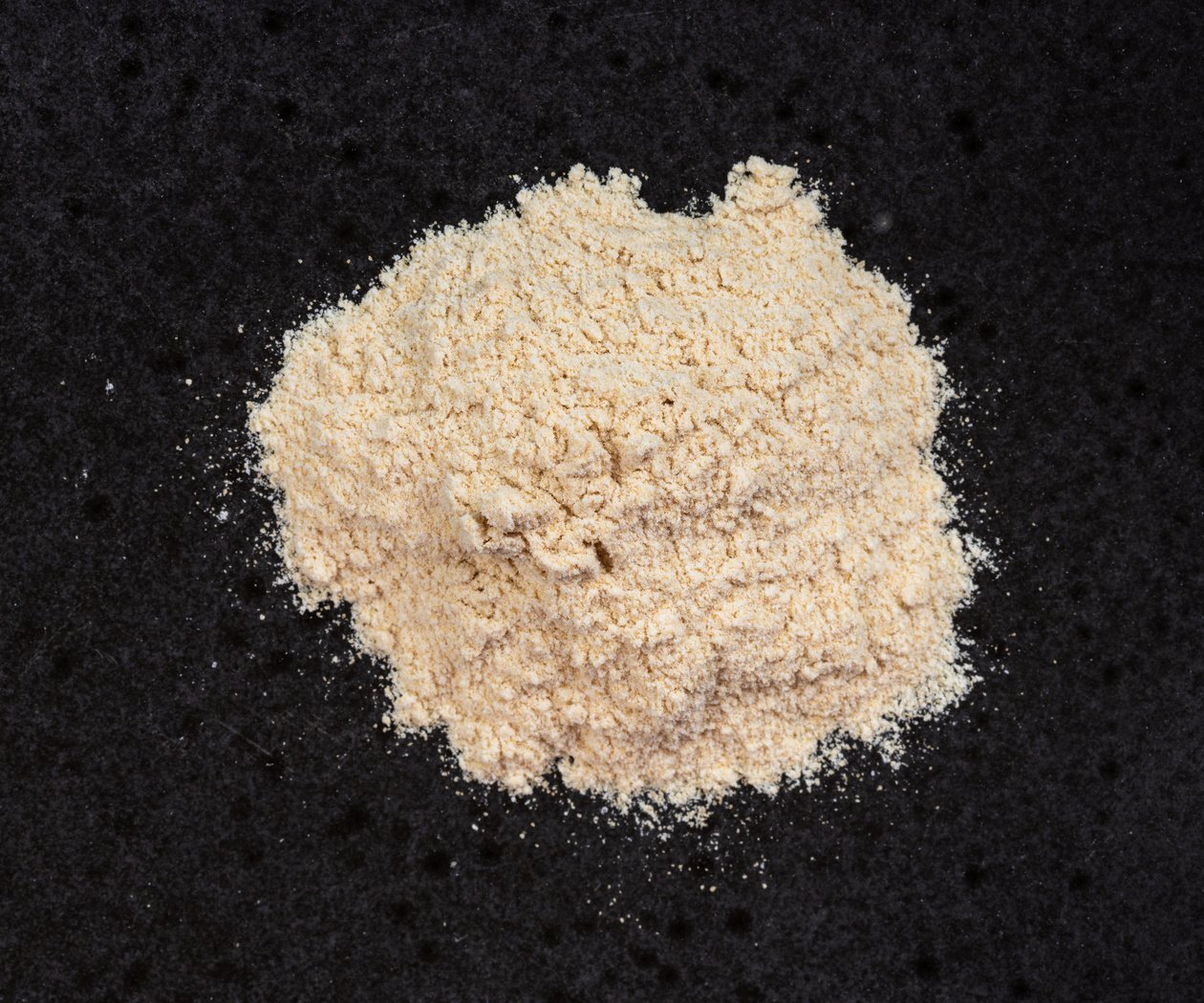 Pile of Apple Pectin Powder Close up on Black